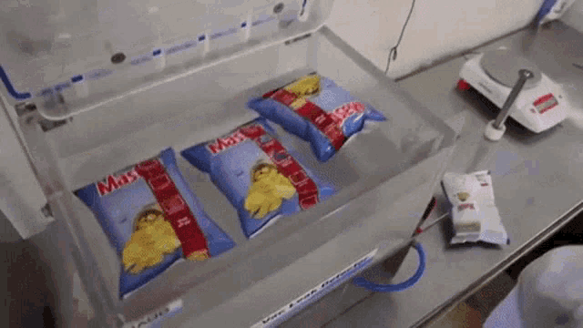 three bags of mash potato chips are sitting in a container