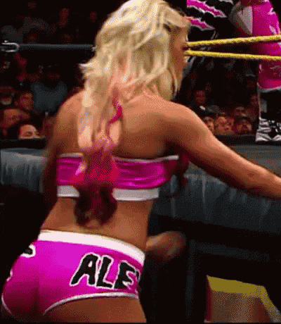 a woman in a pink top and shorts with the word ale on them