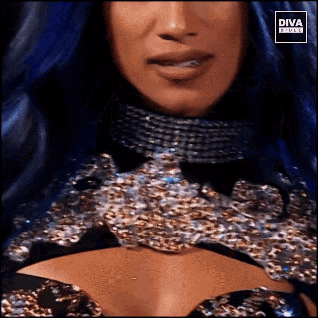 a woman with blue hair is wearing a diva girls advertisement