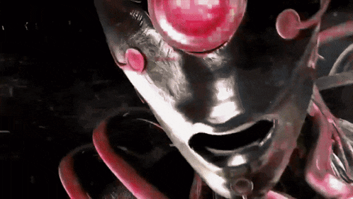 a close up of a person 's face with red eyes