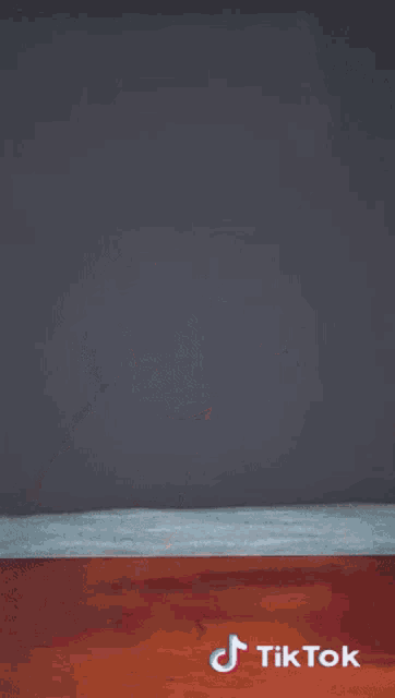 a tiktok video of a person making a peace sign with their hand