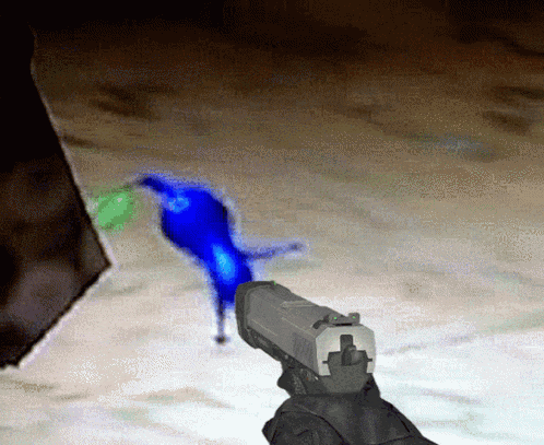 a person is holding a gun in front of a blue bird