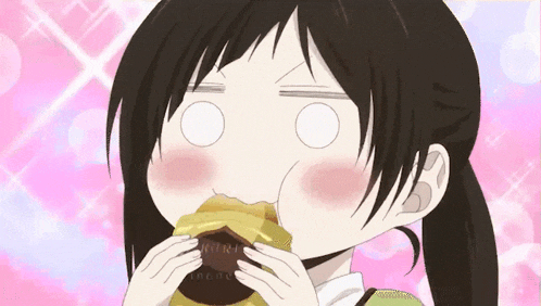 a girl is eating a donut with her eyes closed and her mouth open .