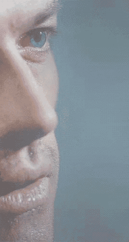 a close up of a man 's blue eye
