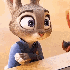 a cartoon rabbit is sitting at a table and looking at a bird .