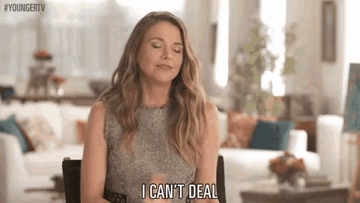 a woman is sitting in a living room with her eyes closed and says `` i can 't deal '' .