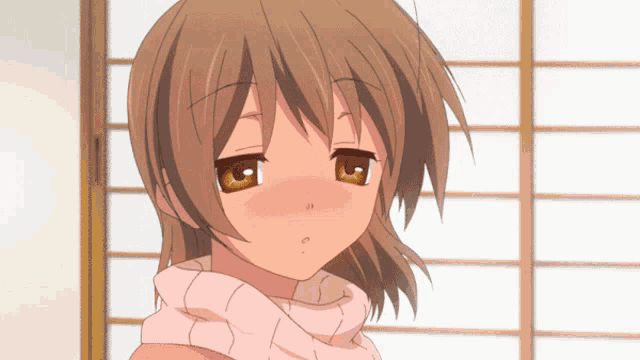 a girl with brown hair is wearing a pink sweater and scarf