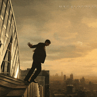a man in a suit is standing on the edge of a building with megapolis written on the top