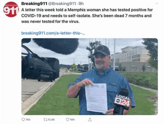 a man is holding a piece of paper in front of a microphone and a sign that says breaking 911