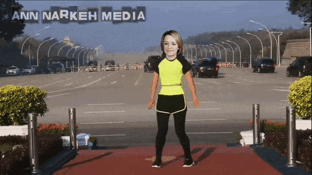 ann narkeh media shows a woman standing on a red carpet in front of a highway