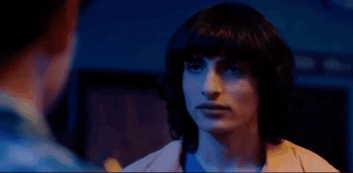 a woman is talking to a man in a dark room and the words `` just find her , okay '' are displayed .