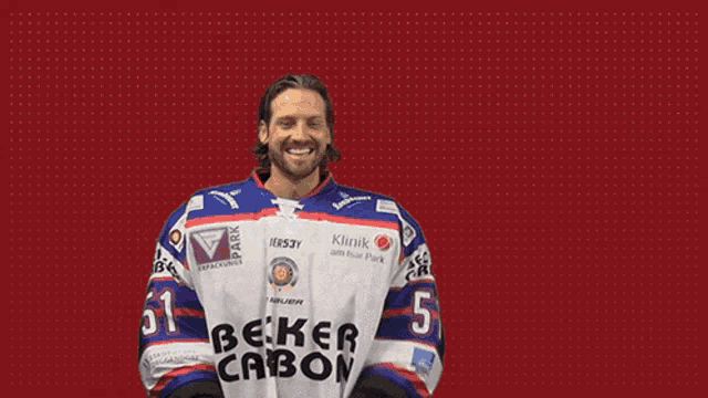 a man wearing a jersey that says beker carbon throws a ball