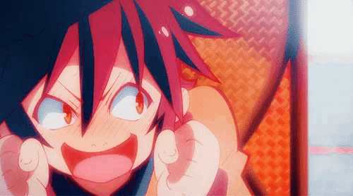 a close up of a cartoon character with red hair and blue eyes pointing at the camera .