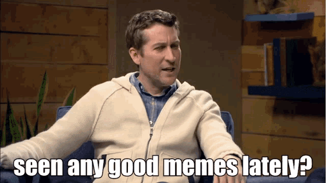 a man sits in a chair with the words seen any good memes lately