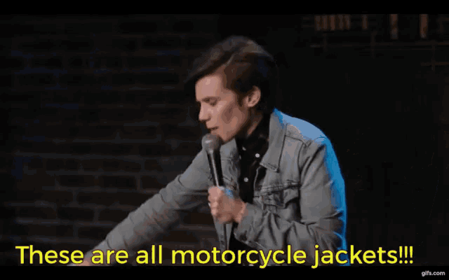 a woman speaking into a microphone with the words these are all motorcycle jackets