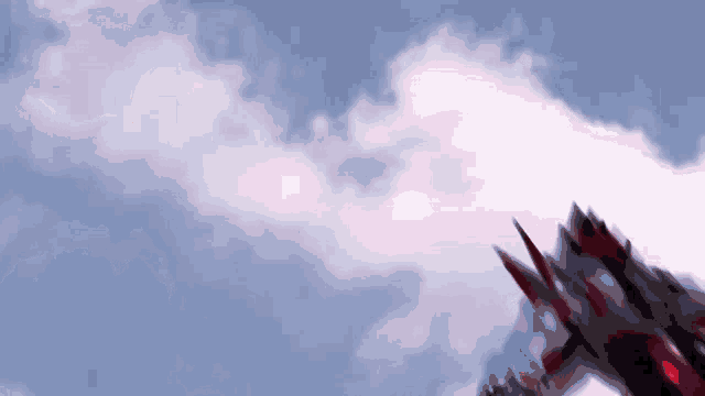 a blurred image of a robot flying through a blue sky with white clouds .