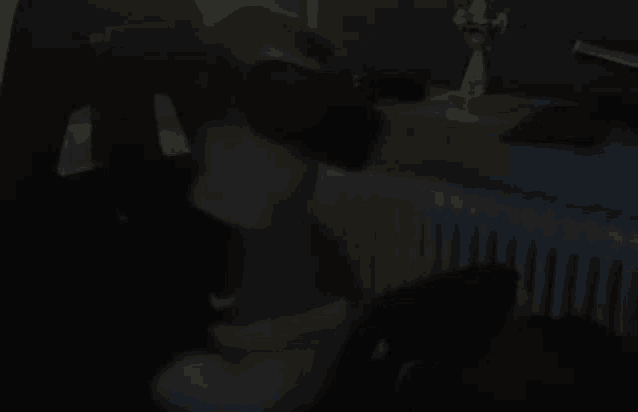 a person is wearing a virtual reality headset in a dark room