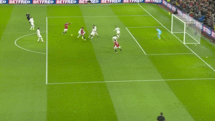a soccer game is being played on a field with betfred banners along the sidelines