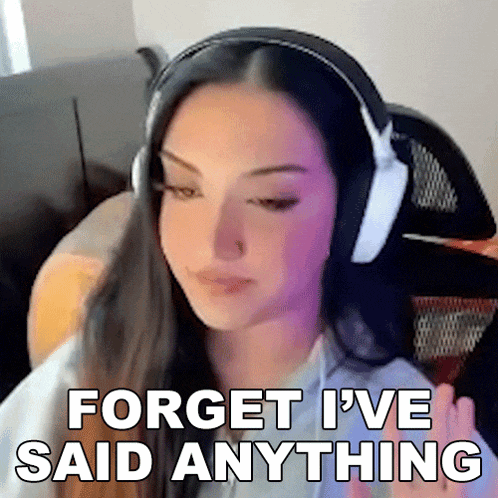 a woman wearing headphones says forget i 've said anything .
