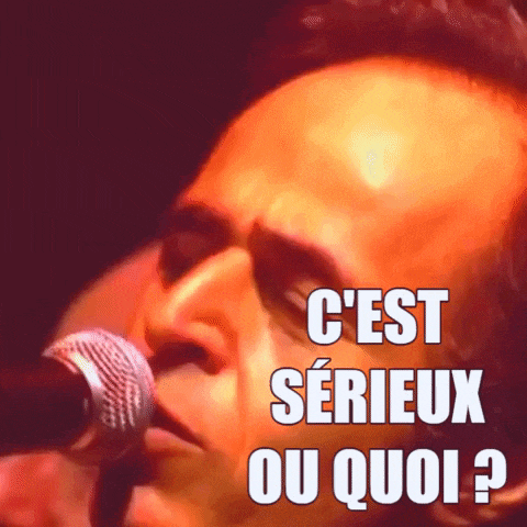 a man singing into a microphone with the words c est serieux ou quoi