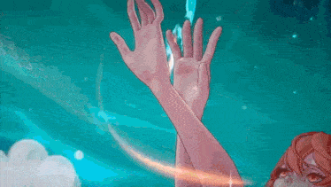a close up of a person 's hands reaching out towards a blue background .