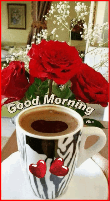 a cup of coffee sits on a saucer next to a bouquet of red roses and the words good morning