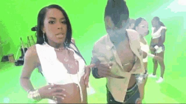 a woman in a white top is standing next to a man in a white shirt .