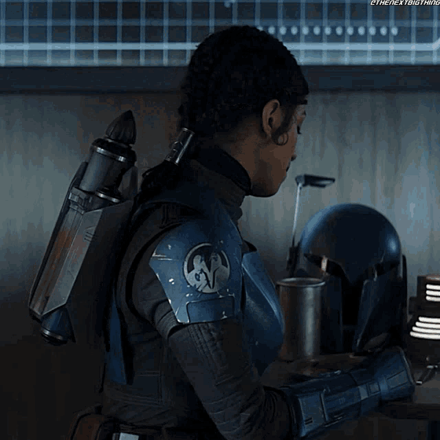 a woman in a star wars costume with the next thing written on the bottom right