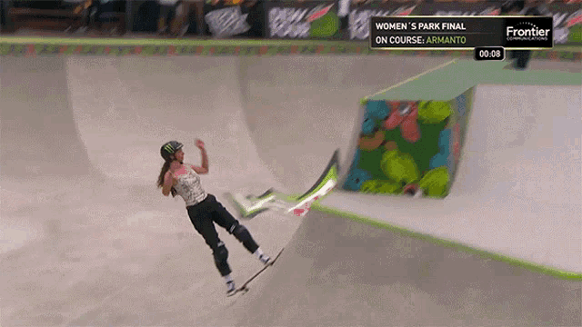 a skateboarder is doing a trick at the women 's park final on course armanto