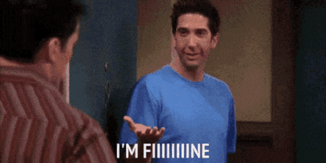 two men are standing in front of a door and one of them is saying i 'm fine