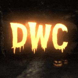 a sign that says dwc is lit up in a dark room