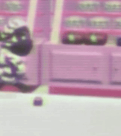 a purple background with a blurred image of a person standing in front of a building .