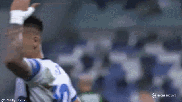 a soccer player with the number 19 on his jersey celebrates