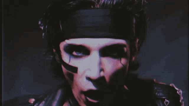 a woman is screaming into a microphone while wearing lace gloves