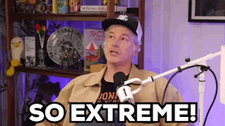 a man in a hat is sitting in front of a microphone and saying `` so extreme '' .