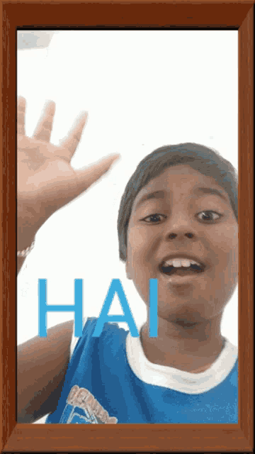 a boy in a blue tank top with the word hai written on his chest