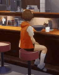 a girl is sitting on a stool in front of a counter in a restaurant .