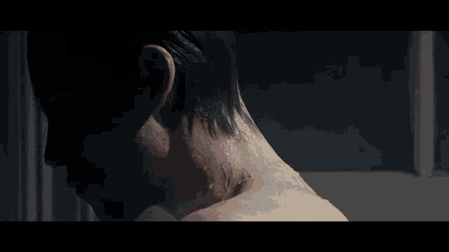 a close up of a person 's neck and shoulder