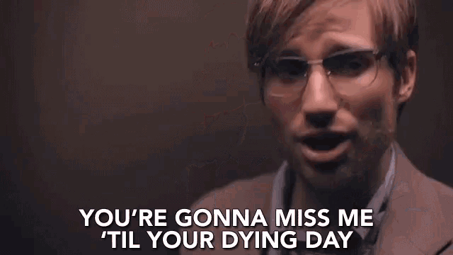 a man wearing glasses and a suit is saying you 're gonna miss me till your dying day .