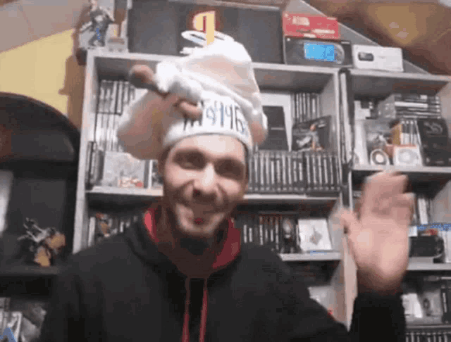 a man wearing a chef 's hat that says jesus