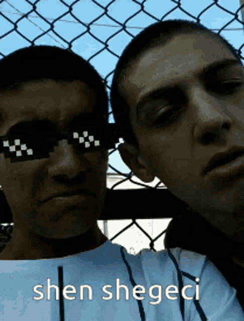 two men wearing sunglasses and the words shen shegeci