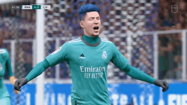 a soccer player wearing an emirates fly better jersey celebrates