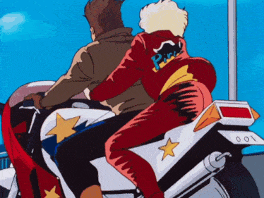 a man and a woman are riding a motorcycle and the woman is wearing a jacket that says pink