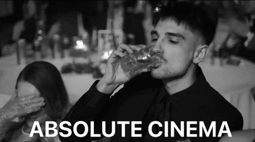 a black and white photo of a man drinking from a glass with the words absolute cinema below him
