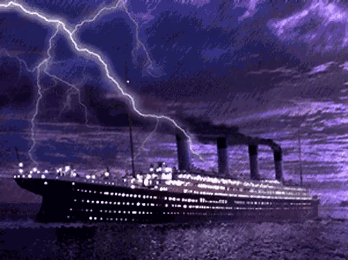 lightning strikes over a ship in the ocean