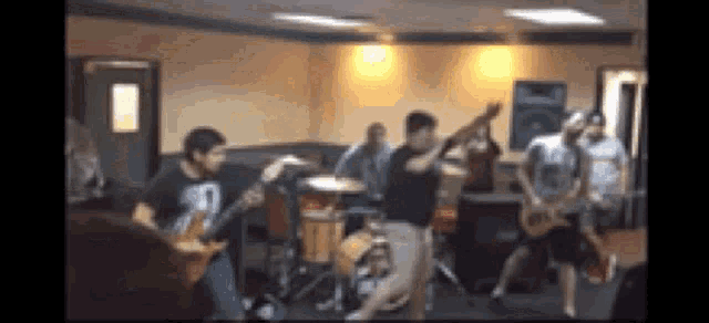 a group of people are playing music in a room