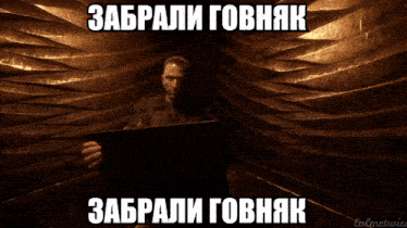 a man holding a sign that says 00 : 00 : 13.92