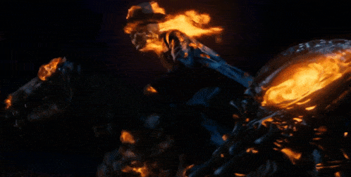 a ghost rider is riding a motorcycle with flames coming out of his head