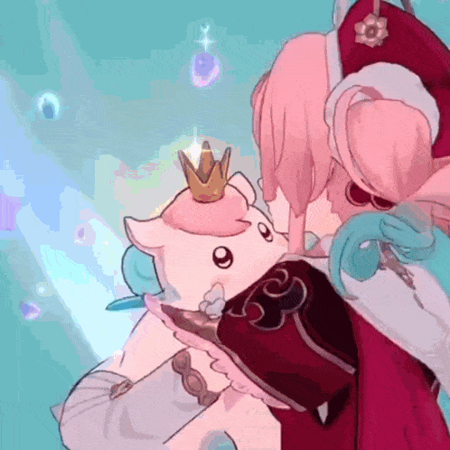 a woman is holding a stuffed animal with a crown on it .