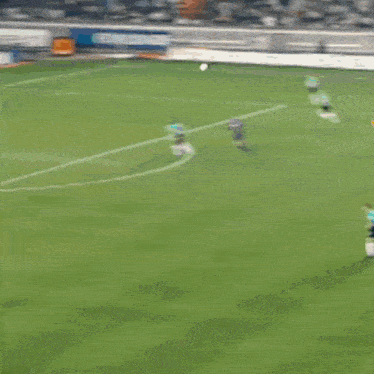 a soccer game is being played on a field with advertisements for nike and thomson